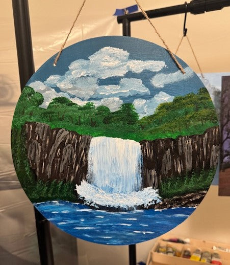 12 inch round waterfall on wood